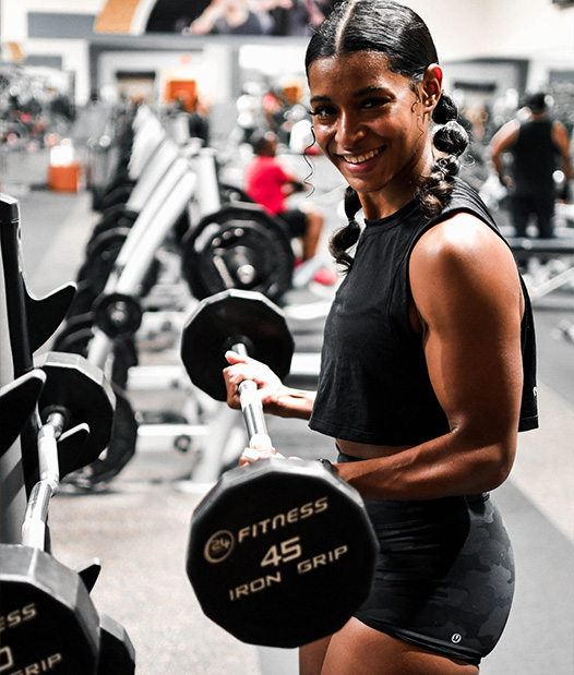 Coach lifting at the gym